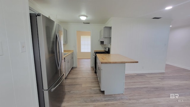 509 Pine St, Daphne, AL 36526 - kitchen featuring stainless steel appliances, butcher block countertops, crown molding, light wood finished floors, and gray cabinetry
