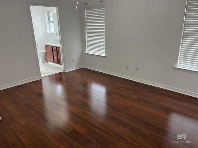 empty room featuring dark hardwood / wood-style floors