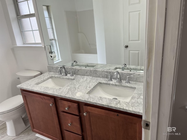 bathroom featuring vanity and toilet