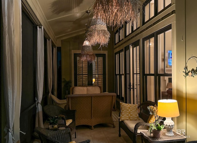 interior space featuring lofted ceiling and a chandelier