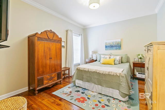 bedroom featuring dark hardwood / wood-style flooring and crown molding