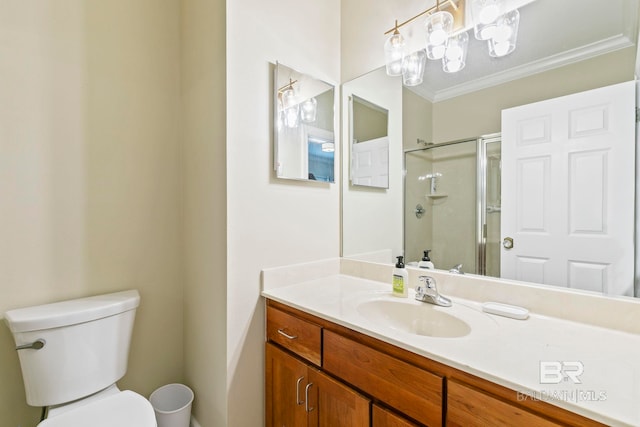 bathroom with ornamental molding, a chandelier, vanity, an enclosed shower, and toilet