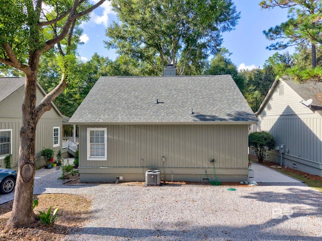 rear view of property with central air condition unit