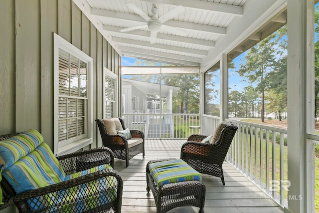 sunroom / solarium featuring vaulted ceiling with beams and wood ceiling