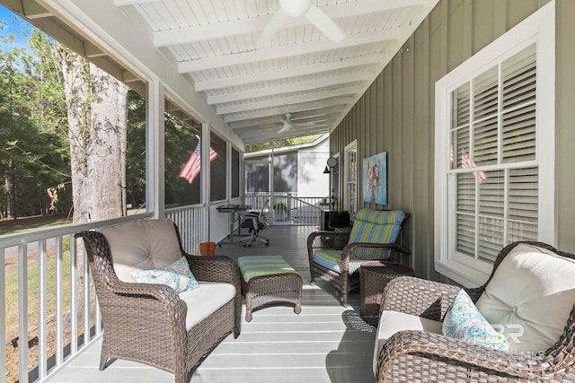 sunroom featuring lofted ceiling with beams and wooden ceiling