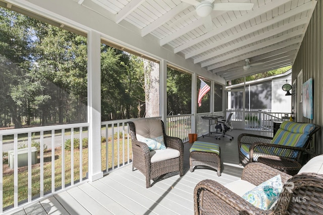 sunroom / solarium with ceiling fan, beam ceiling, and wooden ceiling