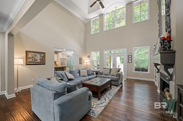 7371 Maureen Cir, Spanish Fort, AL 36527 - living room with a ceiling fan, ornamental molding, a fireplace, dark wood-style floors, and a high ceiling