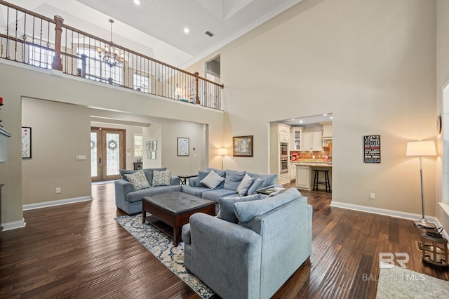 7371 Maureen Cir, Spanish Fort, AL 36527 - living room with dark wood-style flooring, a high ceiling, a chandelier, recessed lighting, and crown molding
