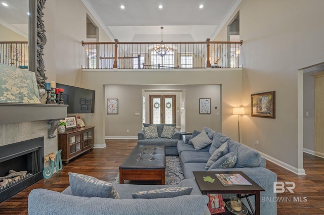 7371 Maureen Cir, Spanish Fort, AL 36527 - living room featuring a chandelier, wood finished floors, plenty of natural light, recessed lighting, and a high ceiling