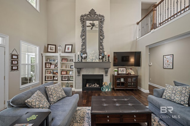 7371 Maureen Cir, Spanish Fort, AL 36527 - living room with a towering ceiling, healthy amount of natural light, a fireplace, and wood finished floors