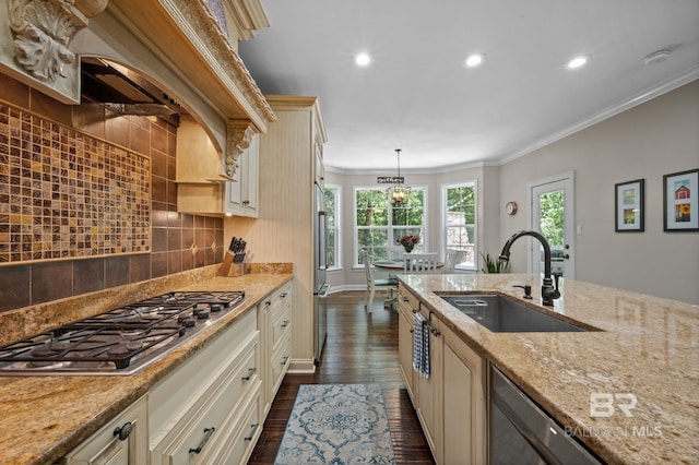 7371 Maureen Cir, Spanish Fort, AL 36527 - kitchen with cream cabinetry, stainless steel appliances, dark wood-style floors, crown molding, and decorative backsplash