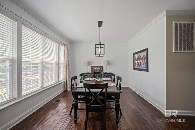 7371 Maureen Cir, Spanish Fort, AL 36527 - dining space featuring dark wood-type flooring and crown molding