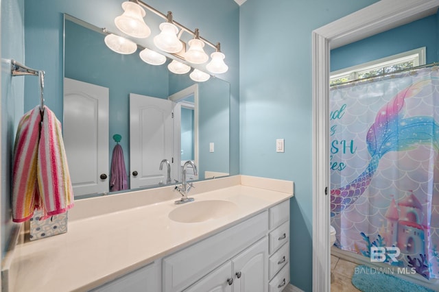 7371 Maureen Cir, Spanish Fort, AL 36527 - bathroom with vanity, a shower with shower curtain, and tile patterned flooring
