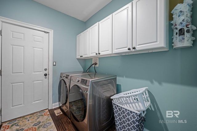 7371 Maureen Cir, Spanish Fort, AL 36527 - laundry area with cabinet space, separate washer and dryer, and dark wood-style flooring