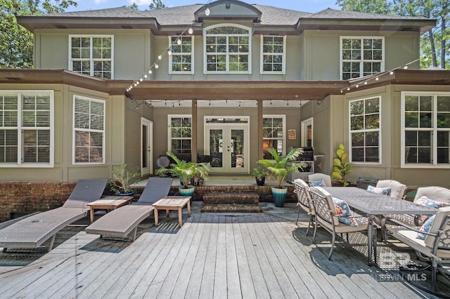 7371 Maureen Cir, Spanish Fort, AL 36527 - wooden deck with french doors and outdoor dining space