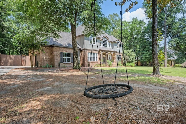 7371 Maureen Cir, Spanish Fort, AL 36527 - back of house featuring brick siding and roof with shingles