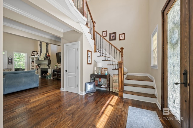 7371 Maureen Cir, Spanish Fort, AL 36527 - entrance foyer with stairway, wood finished floors, a fireplace, and ornamental molding