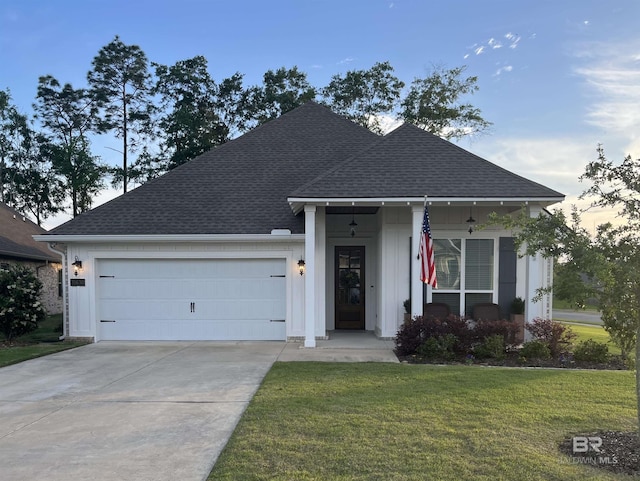 single story home with concrete driveway, a shingled roof, a front lawn, and a garage