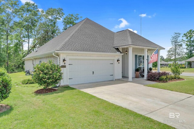 view of front of property featuring concrete driveway, a shingled roof, a front lawn, and a garage