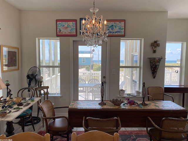 dining room with an inviting chandelier and a healthy amount of sunlight