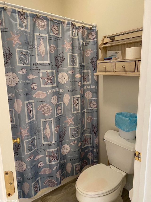 bathroom featuring toilet and hardwood / wood-style flooring