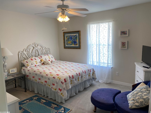 bedroom with ceiling fan and light colored carpet