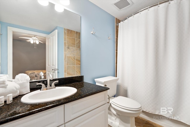 bathroom with vanity, tile floors, ceiling fan, and toilet