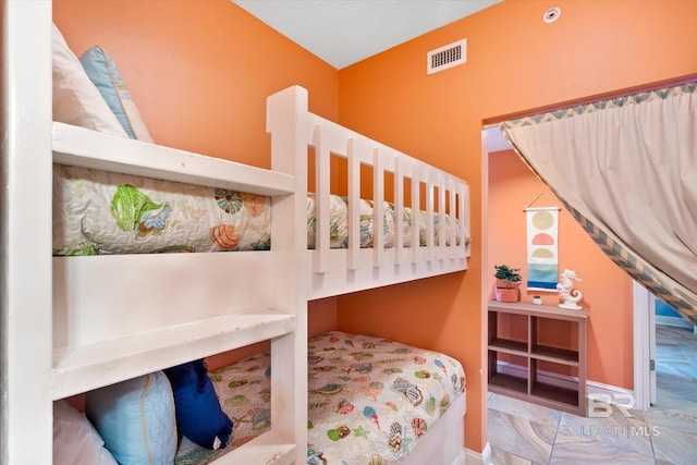 bedroom featuring light tile flooring