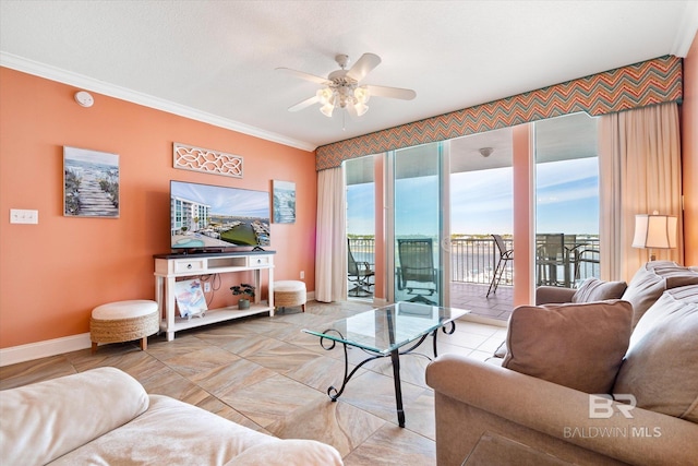 tiled living room with ceiling fan and ornamental molding