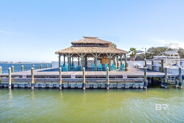 view of dock with a water view and a gazebo