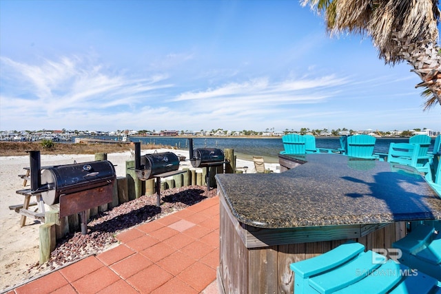 view of patio featuring a water view