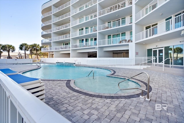 view of swimming pool with a patio