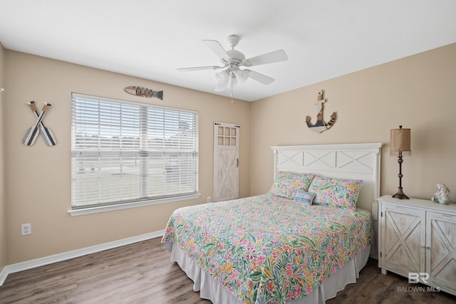 bedroom featuring ceiling fan, baseboards, and dark wood-type flooring