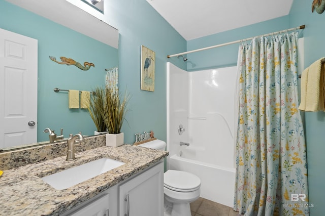 bathroom featuring shower / bath combo, vanity, toilet, and tile patterned floors