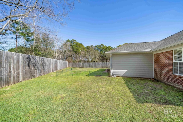 view of yard featuring a fenced backyard