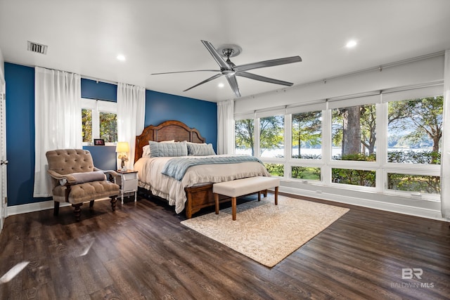 bedroom with recessed lighting, visible vents, multiple windows, and dark wood-style flooring