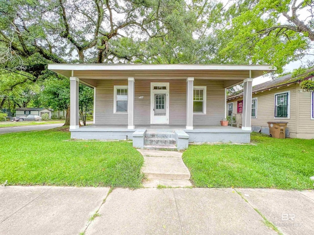 bungalow-style house featuring a porch and a front lawn