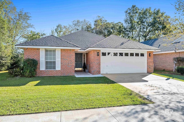 ranch-style house featuring a garage and a front lawn