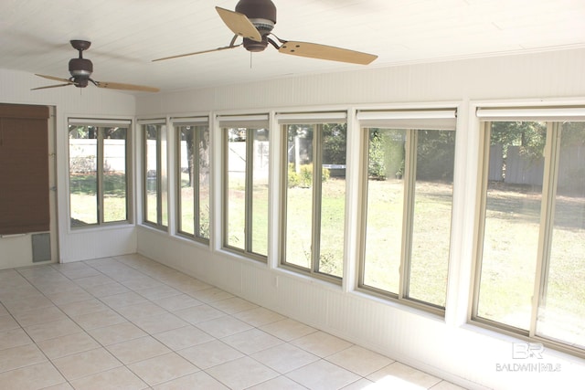 unfurnished sunroom featuring plenty of natural light and ceiling fan