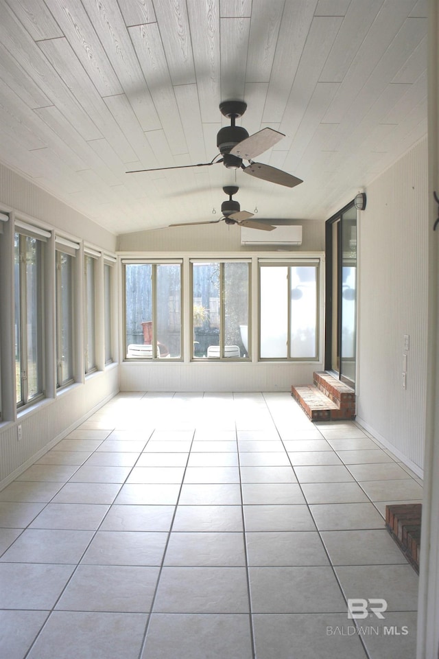 unfurnished sunroom featuring a wall unit AC, ceiling fan, plenty of natural light, and wooden ceiling