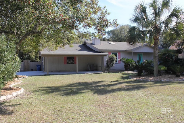 ranch-style house with central AC and a front yard