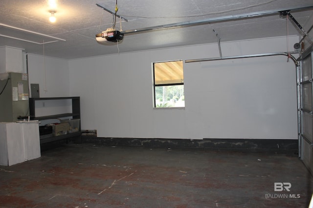 garage featuring electric panel and a garage door opener