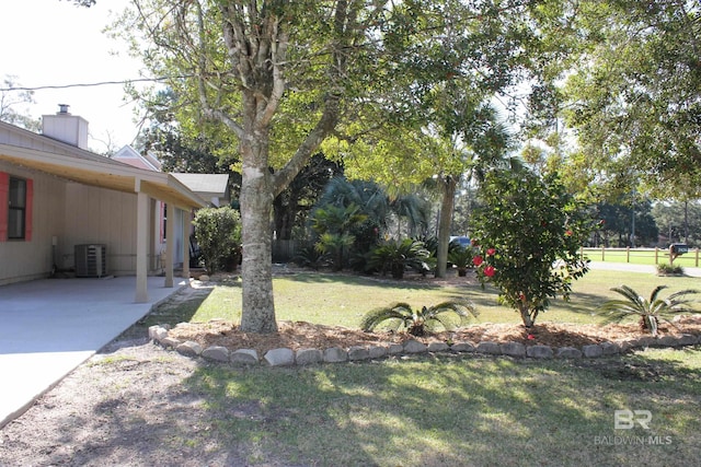 view of yard featuring central AC