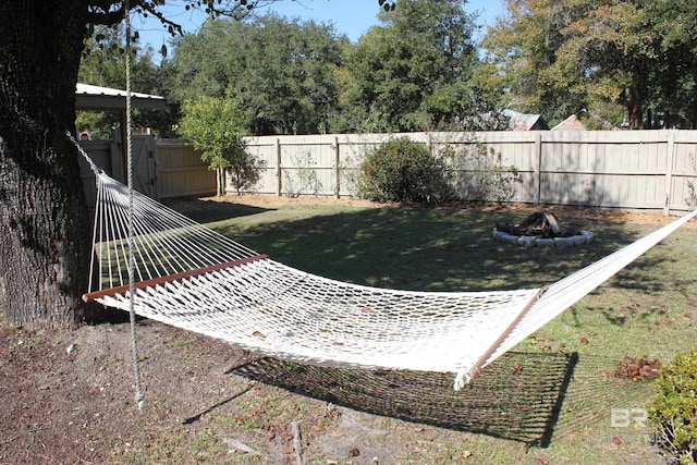 view of yard with an outdoor fire pit