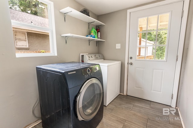 clothes washing area featuring washing machine and dryer