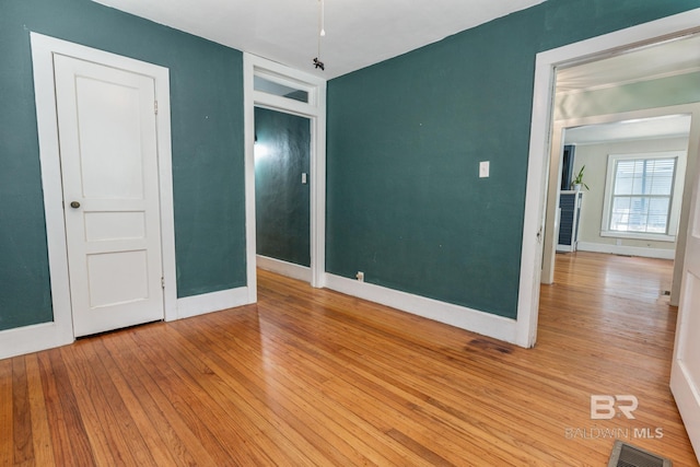 unfurnished bedroom featuring light wood-type flooring