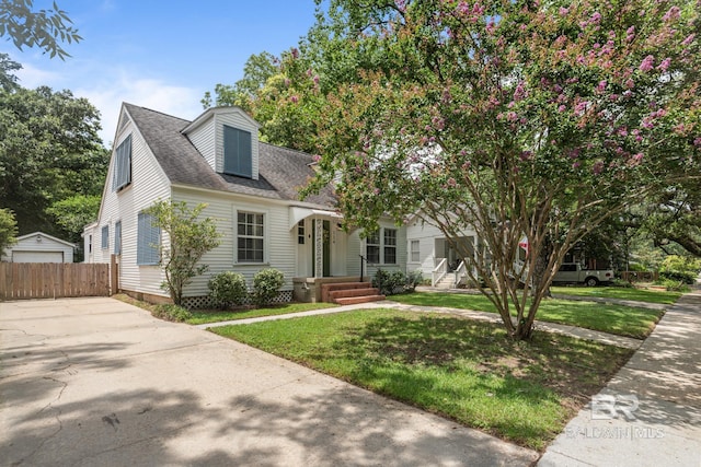 cape cod home with a front lawn