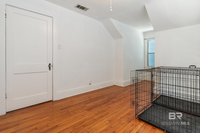 bonus room with wood-type flooring