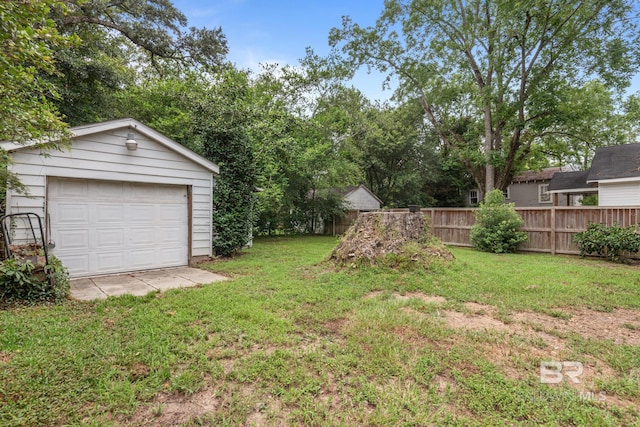 view of yard with a garage and an outdoor structure