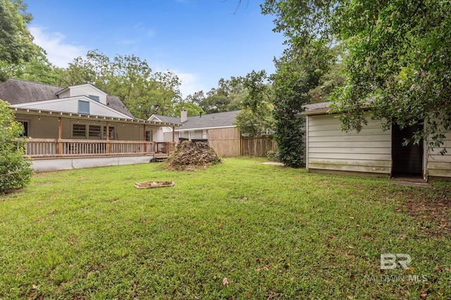 view of yard with a wooden deck